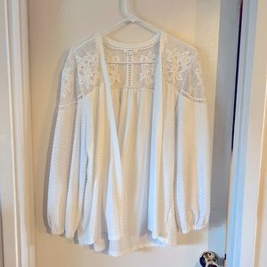 White Maurice’s cardigan with detail.